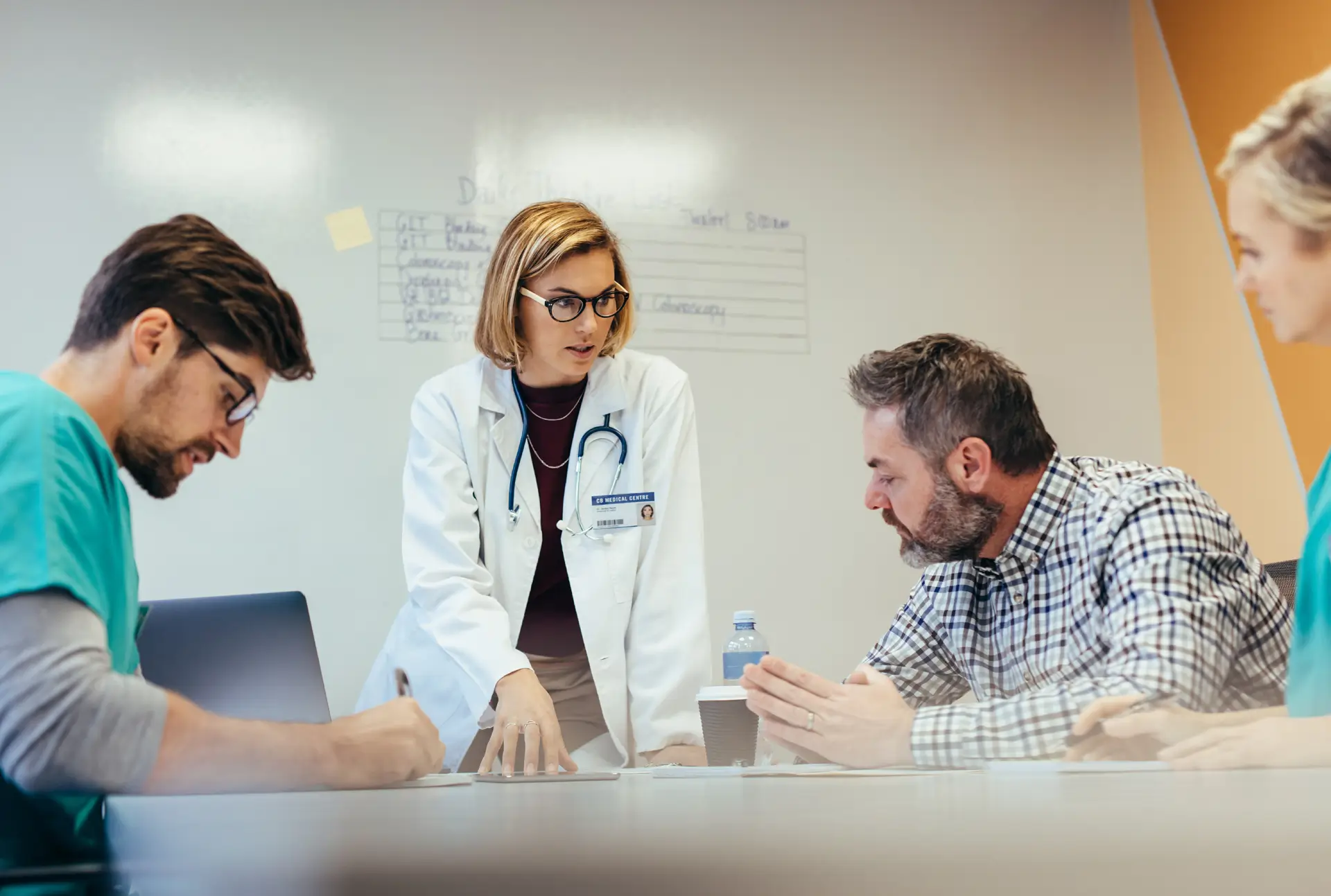 doctors around a table having a discussion