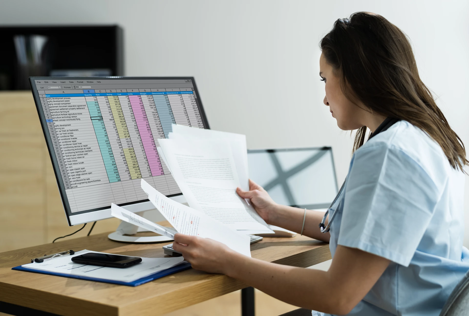 Nurse recording data in a spreadsheet document